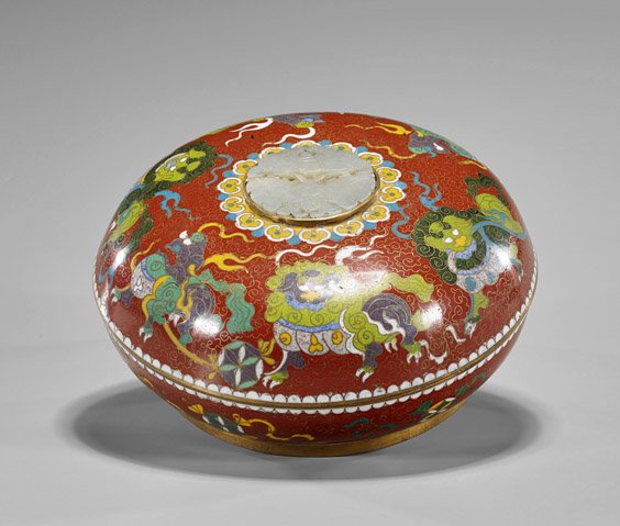 Chinese Cloisonné & Jade Box: Chinese Cloisonné & Jade Box Chinese cloisonné enamel circular box: gamboling lions playing with embroidered balls to top and bottom, carved celadon jade double moth pendant finial; the interior wit