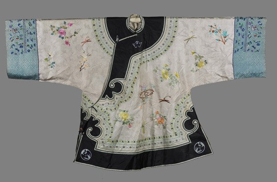 Antique Chinese Cream Silk Robe: Antique Chinese Cream Silk Robe Charming, antique Chinese silk short robe; a few floral sprays and insects embroidered on cream ground, multiple smaller ribbons outlining the dark blue swirl-like hem 