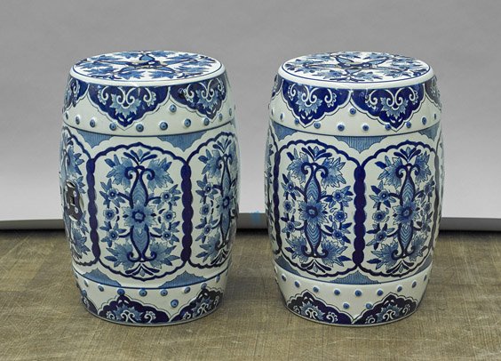Pair Chinese Blue and White Garden Seats: Pair Chinese Blue and White Garden Seats Pair of Chinese blue and white porcelain garden seats; of barrel form with panels of scrolling foliate designs and openwork to seat and body (typical wear and 