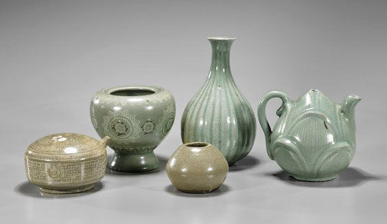 Five Small Korean Celadon Glazed Vessels: Five Small Korean Celadon Glazed VesselsGroup of five small Korean celadon glazed porcelain vessels: circular water dropper with inlaid designs; lotus bud form teapot; ribbed bottle form vase; globula