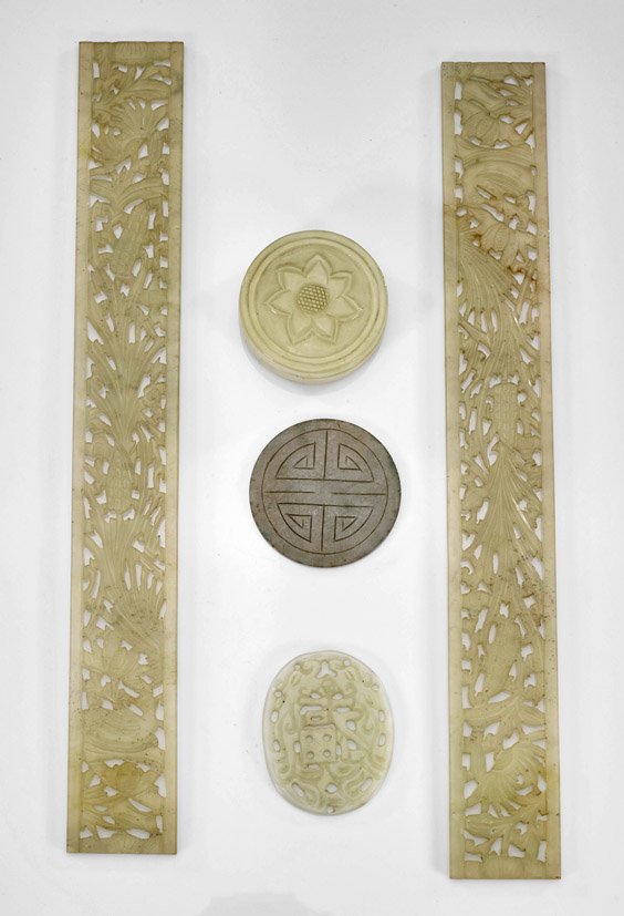 Five Chinese Carved Jade/Hardstones: Five Chinese Carved Jade/HardstonesGroup of five Chinese carved pale green jade and/or hardstones: circular box with flower on cover; pair of foliate rectangular bands; Shou plaque; together with oval