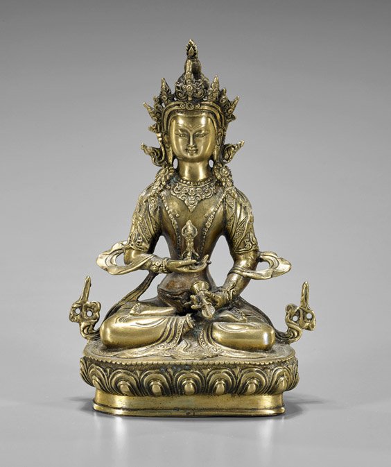 Sino-Tibetan Gilt Bronze Vajrasattva: Sino-Tibetan Gilt Bronze Vajrasattva Sino-Tibetan gilt bronze Buddhist deity; of Vajrasattva seated in lotus position atop a lotus base holding the vajra in his right hand and a bell in his left hand,