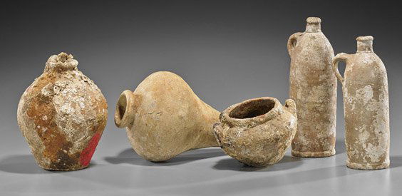 Seven Antique Excavated Continental Porcelains: Seven Antique Excavated Continental PorcelainsSeven antique Continental porcelain vessels with heavy sea life encrustation: three tall cylindrical jugs, transport amphora with some red pigment remaini