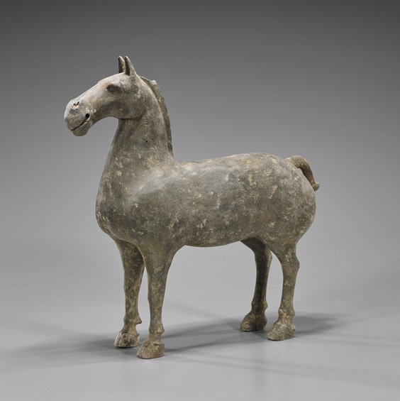 Han Dynasty Grey Pottery Horse: Han Dynasty Grey Pottery Horse Han Dynasty unglazed pottery saddled horse; standing four-square, a small curl to his tail (cracks and chips, repaired ear; as-is); H: 12 1/2"