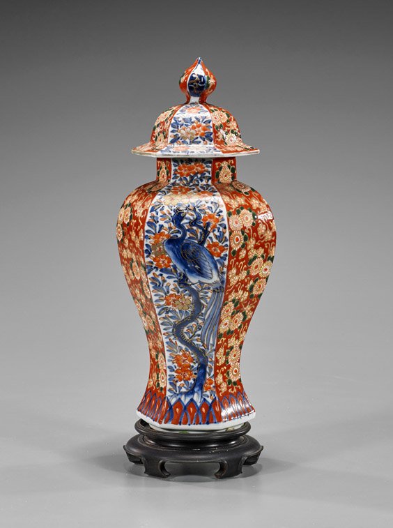 Antique Japanese Imari Covered Jar: Antique Japanese Imari Covered Jar Antique Japanese Imari covered jar; of faceted baluster form with alternating panels of scrolling gilt florals and phoenix, late 19th Century (typical wear and use);