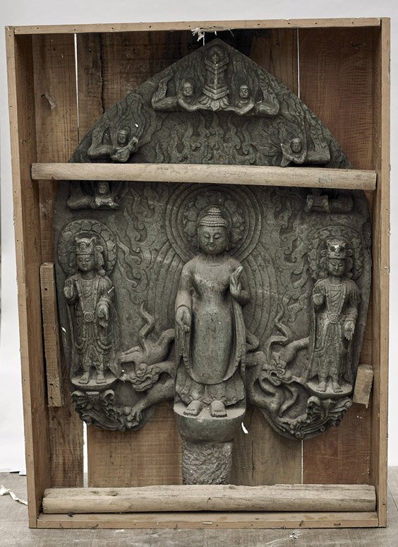 Large Chinese Stone Buddhist Group: Large Chinese Stone Buddhist Group Large Chinese carved dark green stone Buddhist group; centering a standing Buddha flanked by two Bodhisattvas, each with their own aureole, in front of a large mando