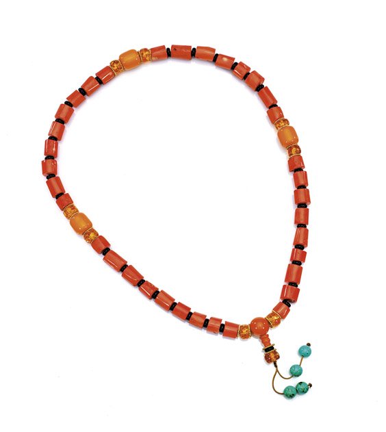 CORAL PRAYER BEAD NECKLACE: CORAL PRAYER BEAD NECKLACE Buddhist prayer bead necklace; comprised of short tubular coral bead necklace; interspersed with compressed amber roundels, amberine, and an amber end bead; pending four tur