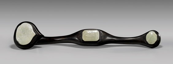 JADE-INSET CARVED WOOD RUYI: JADE-INSET CARVED WOOD RUYI Chinese wood ruyi scepter with three carved celadon jade plaques; two with goldfish in relief, and one with lotus plants; the jades all of fairly even coloration; L: 20"