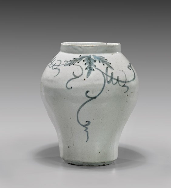 ANTIQUE KOREAN BLUE & WHITE PORCELAIN JAR: ANTIQUE KOREAN BLUE & WHITE PORCELAIN JAR Antique Korean blue and white glazed porcelain jar; of high shouldered form, with wide mouth, the body with sparse foliate tendrils; H: 9 3/4"