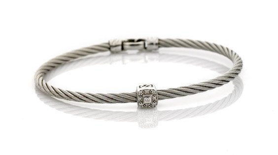 CHARRIOL BY ALOR CABLE BRACELET: CHARRIOL BY ALOR CABLE BRACELET14K white gold and steel cable bracelet Charriol by Alor; set with a single squared link set pavé-set with diamonds; signed; D: 2" - 2 1/4" (approx.)