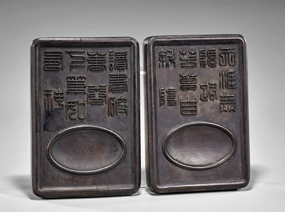 Pair Chinese Carved Zitan Wood Inkstones: Pair Chinese Carved Zitan Wood Inkstones Pair of Chinese carved zitan wood inkstones; each of rectangular form with shallow well at top and several lines of archaistic styled calligraphy (multiple cra