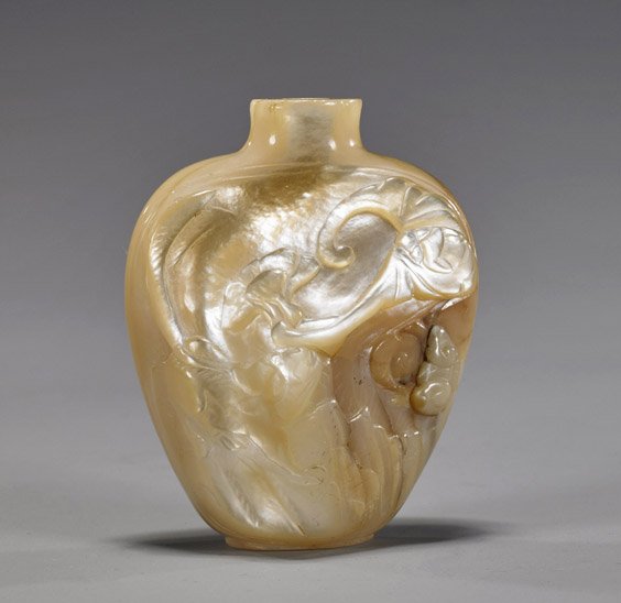 Antique Mother of Pearl Snuff Bottle: Antique Mother of Pearl Snuff Bottle Antique carved mother of pearl snuff bottle; of spade form with raised base, a squirrel, bat and lingzhi mushroom to front, Shou emblem to verso; no stopper; minor