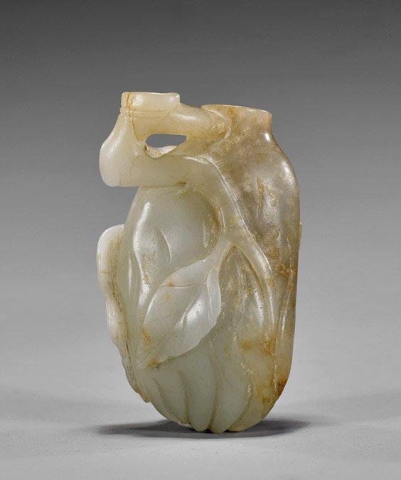 Carved White Jade Snuff Bottle: Carved White Jade Snuff Bottle Carved white jade snuff bottle; of a Buddha's hand citron, openwork branch to top and bat along the side; russet suffusions (no stopper, minor flaws); H: 2 5/8"