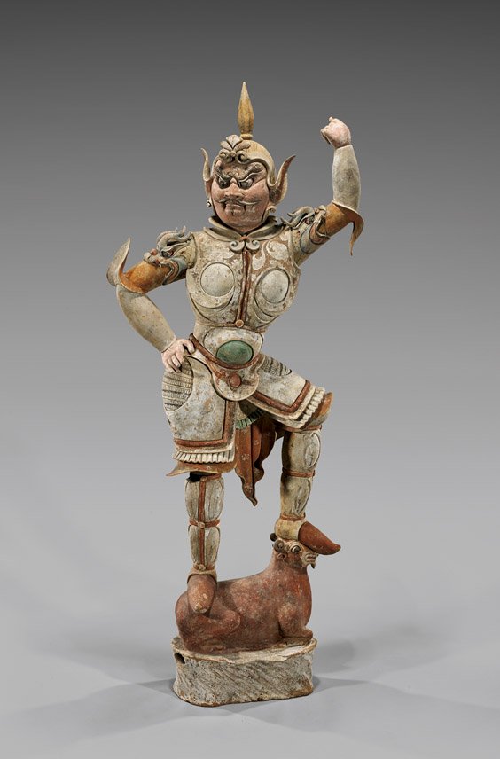 TANG DYNASTY POTTERY LOKAPALA: TANG DYNASTY POTTERY LOKAPALA Beautifully detailed, Chinese Tang Dynasty painted pottery Lokapala; depicted in a fierce stance, standing atop a recumbent ram, and dressed in fine armor with qilin moti