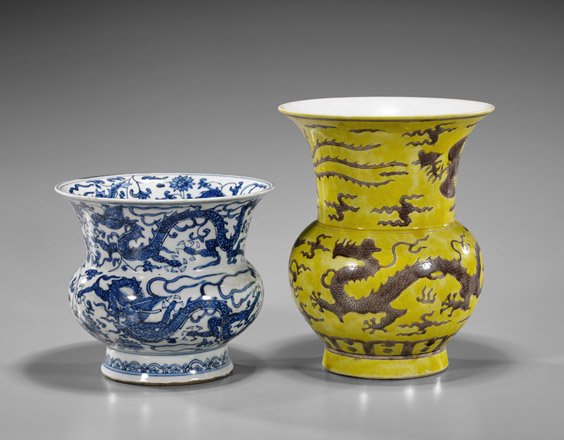Two Chinese Porcelain Spittoons: Two Chinese Porcelain Spittoons Two Chinese porcelain spittoons: Ming-style blue and white of sinuous dragons amid scrolling flowers; together with yellow glazed aubergine dragons and phoenixes amid c