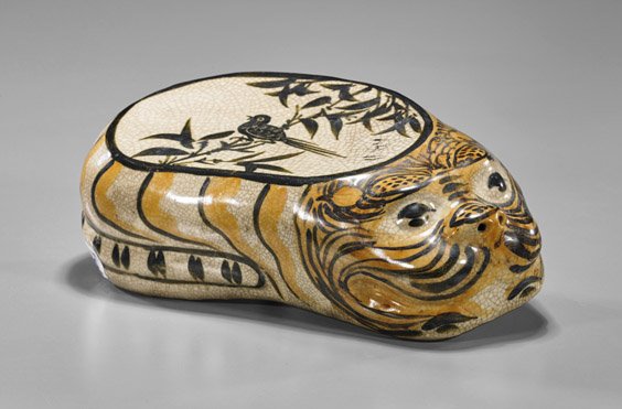 Old Chinese Cizhou Glazed Tiger Pillow: Old Chinese Cizhou Glazed Tiger Pillow Old Chinese cizhou crackle glazed porcelain pillow; of a recumbent tiger with bird perched on a branch to cover (some wear and minor flaws); L: 11 3/4"