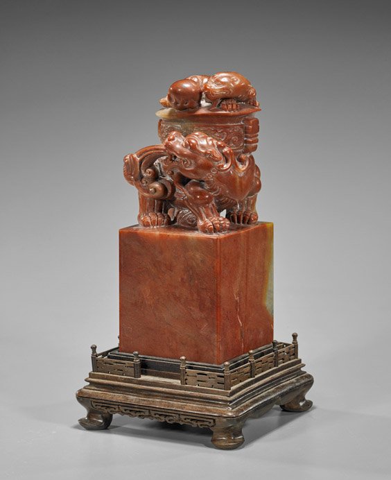 Large Chinese Carved Soapstone Seal: Large Chinese Carved Soapstone Seal Large Chinese carved soapstone seal; two hydra guarding a precious vessel and flaming pearl atop tall square plinth, unworked (some scratching and discoloration); H