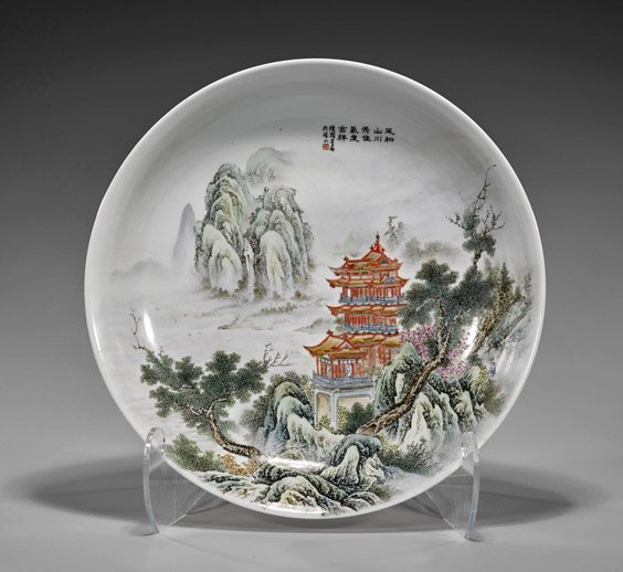 Chinese Enameled Porcelain Charger: Chinese Enameled Porcelain Charger Chinese enameled porcelain charger; depicting a large towering multi-tiered pagoda amid a misty landscape; inscription and seal marks; D: 16 1/4"