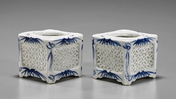 Four Antique Chinese Porcelains: Four Antique Chinese Porcelains Group of four antique Chinese porcelains: pair of blue and white square form incense burners with reticulated floral sides, stylized bamboo leaves to corners; together 