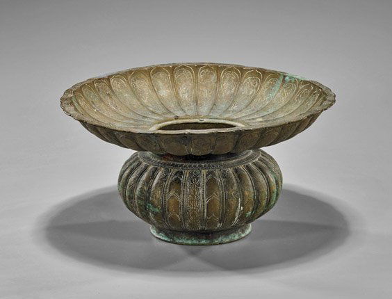 Antique Middle Eastern Bronze Jar: Antique Middle Eastern Bronze JarAntique Middle Eastern bronze jar; of globular form with an attached wide scalloped rim, each with ribbed and faint floral etching details (considerable wear and patin