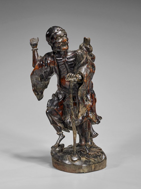 Antique Chinese Carved Wood Lohan: Antique Chinese Carved Wood Lohan Antique Chinese carved wood Lohan; standing atop auspicious fungus mound, leaning forward with his weight on a staff and double gourd jug slung over his back (conside