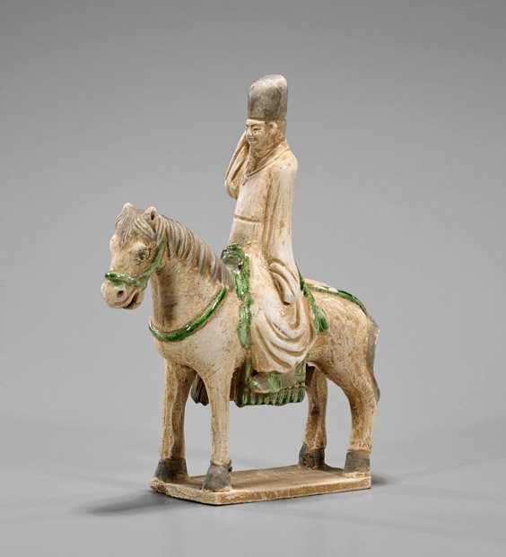 Ming Dynasty Pottery Horse & Rider: Ming Dynasty Pottery Horse & Rider Chinese Ming Dynasty pottery horse and rider; of an official sitting upon a horse standing four-square atop a plinth, the reins and seat in green glaze and details i