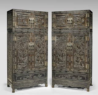 PAIR TALL CARVED ZITAN CABINETS: PAIR TALL CARVED ZITAN CABINETSPair of tall and finely craved, Chinese zitan wood, stacked, four-door cabinets; each front panel with narrative figural design depicting a boys' festival, with children