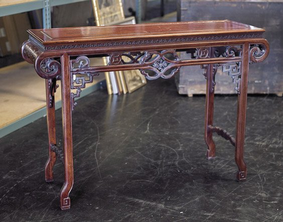 Carved Wood Altar Table: Carved Wood Altar Table Chinese carved wood altar table; with foliate and coin motif apron, resting on four narrow legs with lingzhi mushroom stretcher (heavy use and flaws; as-is); L: 53"