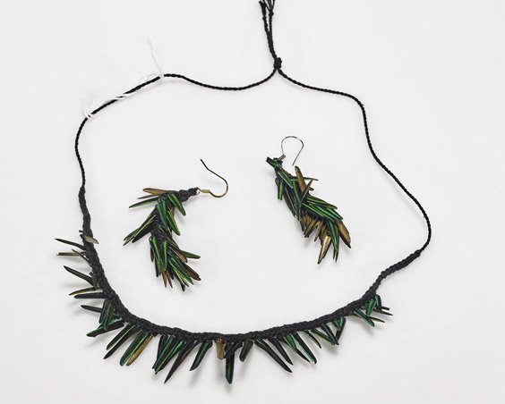 Rare Amazonian Beetle Necklace & Earrings: Rare Amazonian Beetle Necklace & Earrings Rare Amazonian Callichroma beetle wing jewelry: bib necklace comprised of slender wing covers on black braid; together with pair of dangling earrings with clu