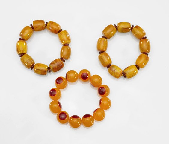 Three Buddhist Bead Bracelets: Copal & Resin: Three Buddhist Bead Bracelets: Copal & ResinGroup of three Buddhist bead bracelets: two comprised of barrel-form copal beads of a warm honey tone, with amberine spacers; the third of copal-like, round
