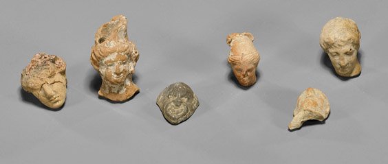 Six Greco-Roman Terracotta Heads: Six Greco-Roman Terracotta Heads Group of six ancient Greco-Roman terracotta heads: black slip grotesque man, bald man and four females (considerable wear; as-is); L: 1 7/8"