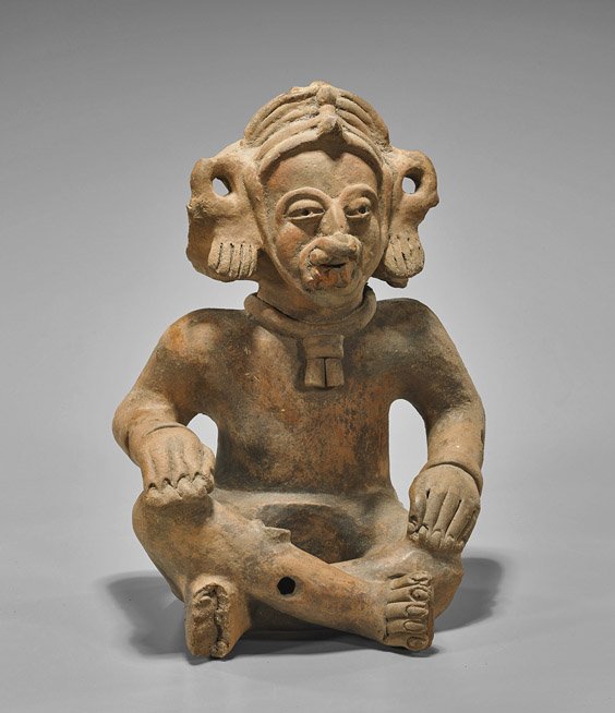 Pre-Columbian Mayan Seated Shaman: Pre-Columbian Mayan Seated Shaman Pre-Columbian (Mayan) pottery shaman; seated with right leg over left and resting hands on knees, wearing an animal skin headdress and elaborate nose ring, several dr