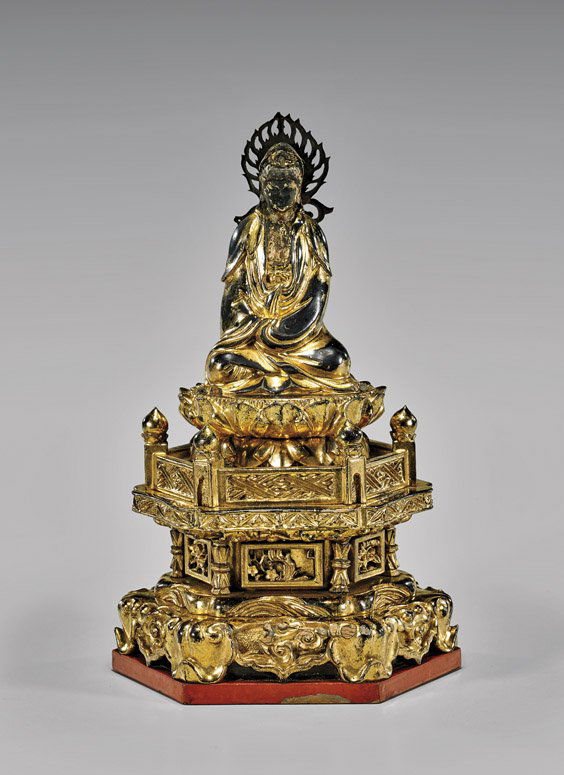 ANTIQUE JAPANESE LACQUER BUDDHA: ANTIQUE JAPANESE LACQUER BUDDHAAntique and elaborately carved, Japanese gilt lacquer wood figure; of Buddha, seated high up on a double lotus base, upon a galleried pedestal stand; H: 9 1/4"; Provenan