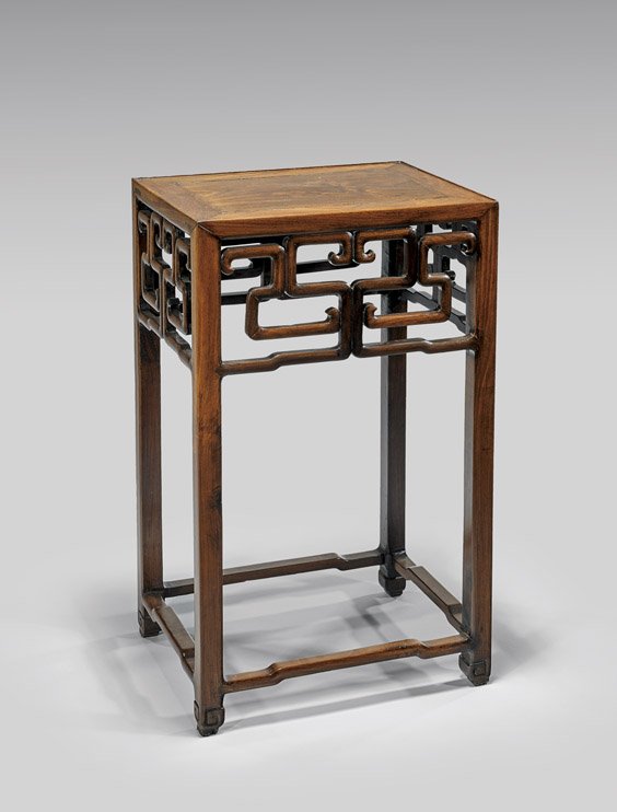 CHINESE ROSEWOOD PEDESTAL: CHINESE ROSEWOOD PEDESTALChinese rosewood pedestal; of rectangular form, with archaistic, rectilinear openwork aprons, set on shaped feet; H: 31 7/8"