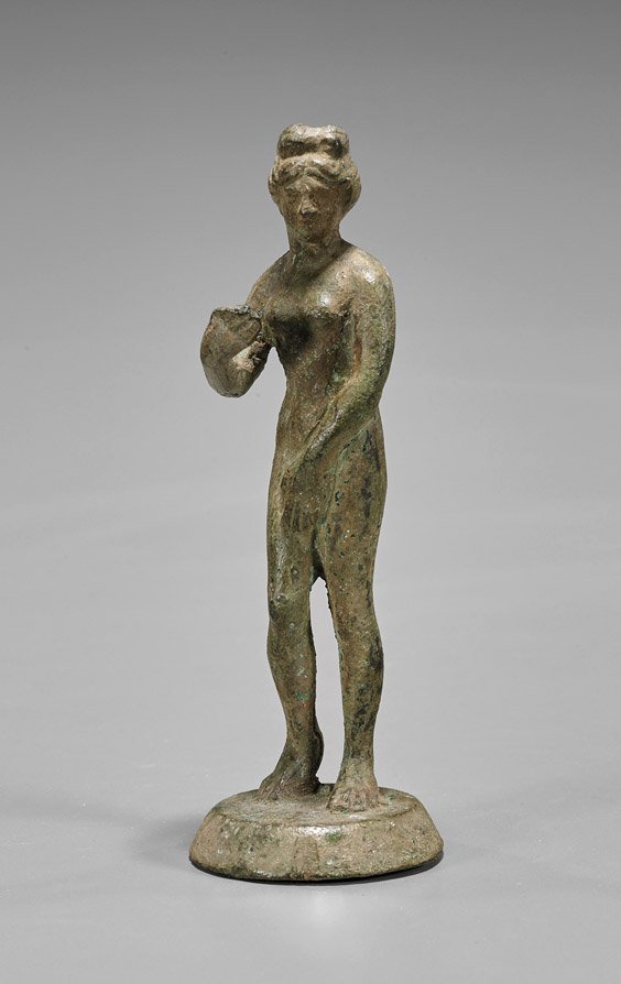 Ancient Roman Bronze Venus: Ancient Roman Bronze Venus Ancient Roman bronze nude figure of Venus; depicted in her modest form, her left hand over her genitalia and right hand extended; her hair wrapped up in a topknot (heavy wea