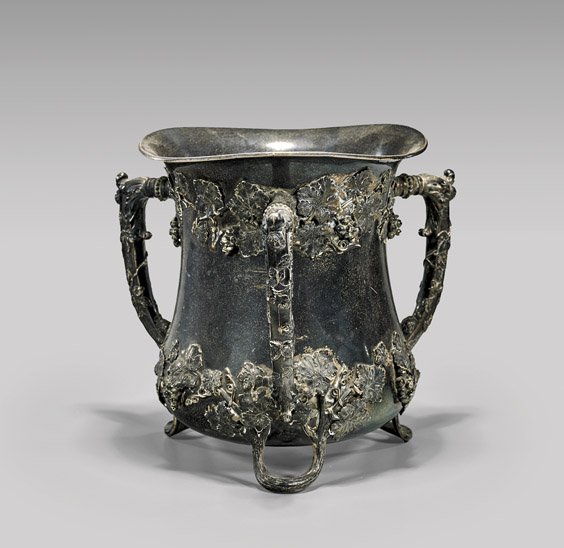 LARGE GORHAM SILVER WINE COOLER: LARGE GORHAM SILVER WINE COOLER Large Gorham sterling silver wine cooler vessel; of waisted form with undulating rim, three vine-clad handles, the body decorated in fruiting grapevines in relief, and 