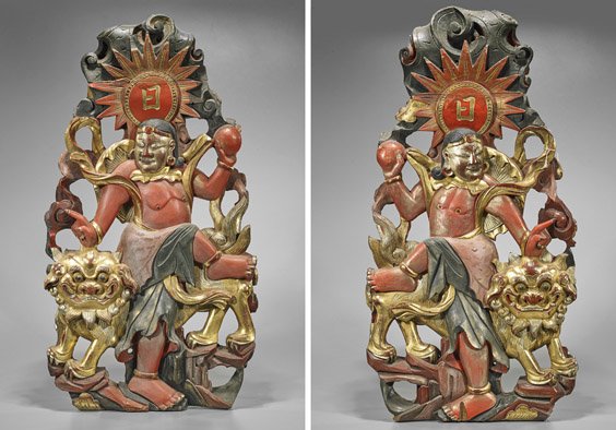 Pair of Chinese Lacquered Wood Plaques: Pair of Chinese Lacquered Wood Plaques Pair of Chinese gilt, lacquer and carved wood plaques; depicting a mirror image of two figures each with a ball in one hand and a lion aside all below a sunburst