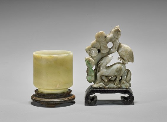 Two Chinese Carvings: Jadeite Deer & Bowenite Cup: Old Chinese carved jadeite deer with crane and pine trees; together with antique Chinese carved bowenite cup;; H: 3½" (taller), wood stands