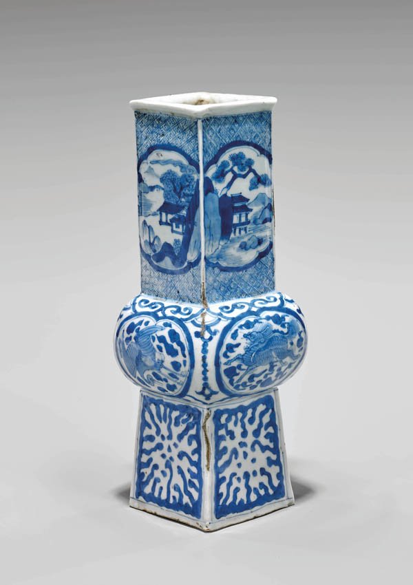 ANTIQUE CHINESE BLUE & WHITE SQUARED VASE: Antique Ming dynasty Chinese blue and white porcelain vase; of squared baluster form, the bulbous center alternating crane and qilin reserves, the upper section with serene landscape panels reserved o
