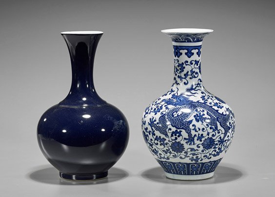 Two Qianlong-Style Porcelain Bottles Vases: Two Chinese Qianlong-style porcelain bottle vases: of deep midnight blue with low rounded body; together with blue and white of sinuous dragons with higher shoulders; seal marks to each; H: 13 1/8"
