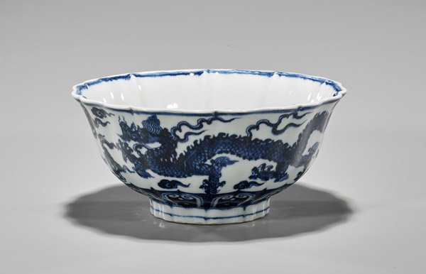 Xuande-Style Blue & White Scalloped Dragon Bowl: Chinese Xuande-style blue and white porcelain dragon bolw; of deep footed form and scalloped rim, designs of ainuous dragons amid clouds; 6-character mark; D: 7 3/4"