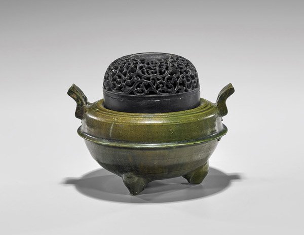 Han Dynasty Green Glazed Tripod Censer: Chinese Han Dynasty, green glazed pottery tripod censer; the shallow wide form with a raised ridge around the center, with two short flared handles, and set on three bulbous legs; Provenance: From the