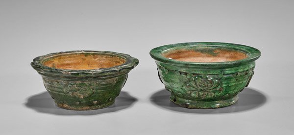 Pair Ming Dynasty Green Glazed Bowls: Pair of Chinese late Ming Dynasty green glazed pottery bowls; each with moulded floral designs, one with foliate rims; D: 7 5/8" (larger)