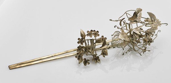 Old Chinese White Metal Hairpin: Old Chinese white metal hairpin; with two prongs and a large decorative end with birds amid flowers; L: 9 1/2"