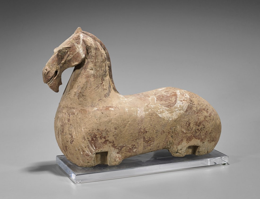 Han Dynasty Painted Pottery Horse: Chinese Han Dynasty painted pottery horse; of the large torso and with a small head slightly curved down; L: 17"; lucite stand