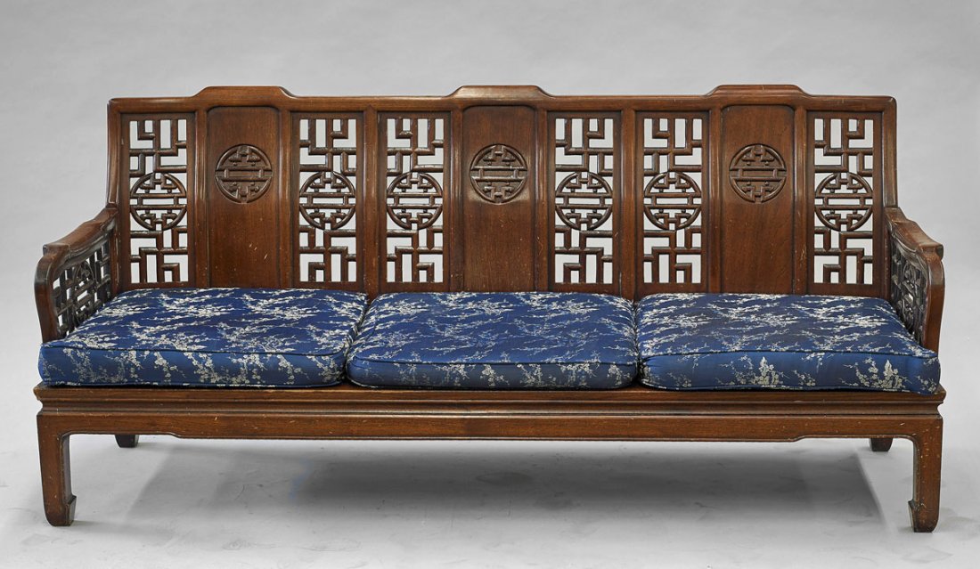 Chinese Carved Hardwood Furniture Set: Sofa & Chair: Chinese carved hardwood sofa and chair set; both with Shou characters set amid alternating openwork and solid panels; with blue floral cushions; L: 72" (larger)