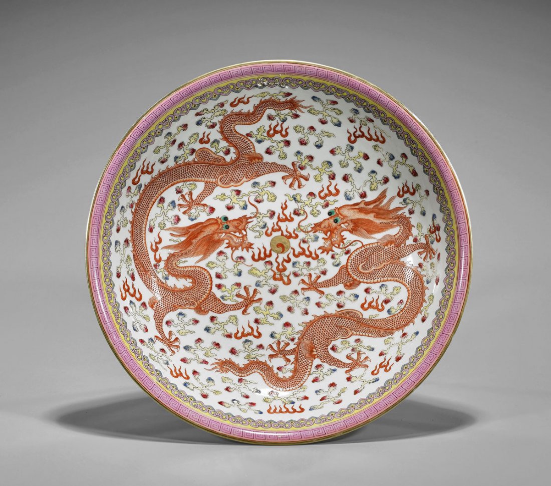 Chinese Enameled Porcelain Dragon Charger: Chinese Qing-style enameled porcelain charger; with design of dragons contesting a gilt flaming pearl; six-character Guangxu mark to base; D: 13 3/4"