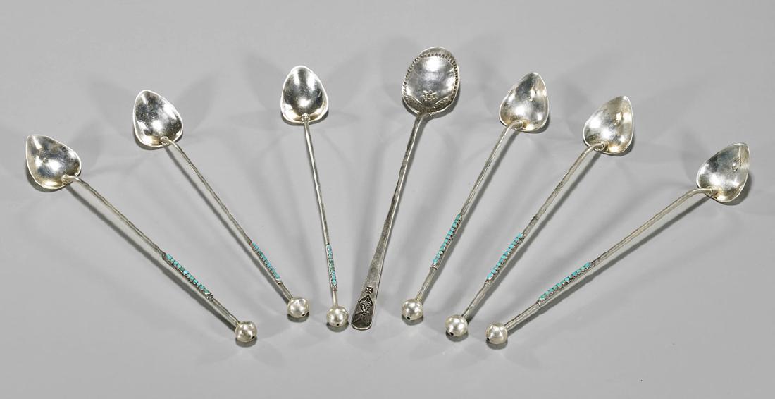 Seven Old Silver Iced Tea Spoons: Group of seven silver iced tea spoons: six matching with spade form head and terminating in a hollow sphere, each slim handle set with turquoise; together with one engraved with geometric motif, proba