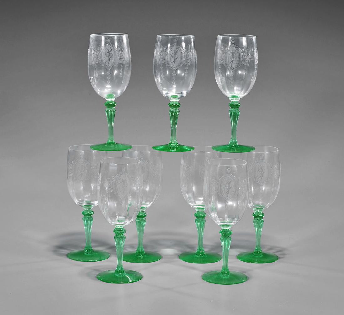 Set of Nine Old Etched Glasses: Set of nine old etched glasses; each with panels showing a nude woman dancing with sash and bird, encircled by foliate tendrils; set upon a green columnar stem; H: 7 7/8" (each)