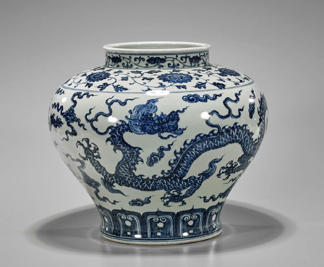 Blue & White Porcelain Dragon Jar: Chinese blue and white porcelain jar; with dragons amid stylized clouds, and floral borders; Xuande mark to shoulder; D: 13 1/2" (approx.)